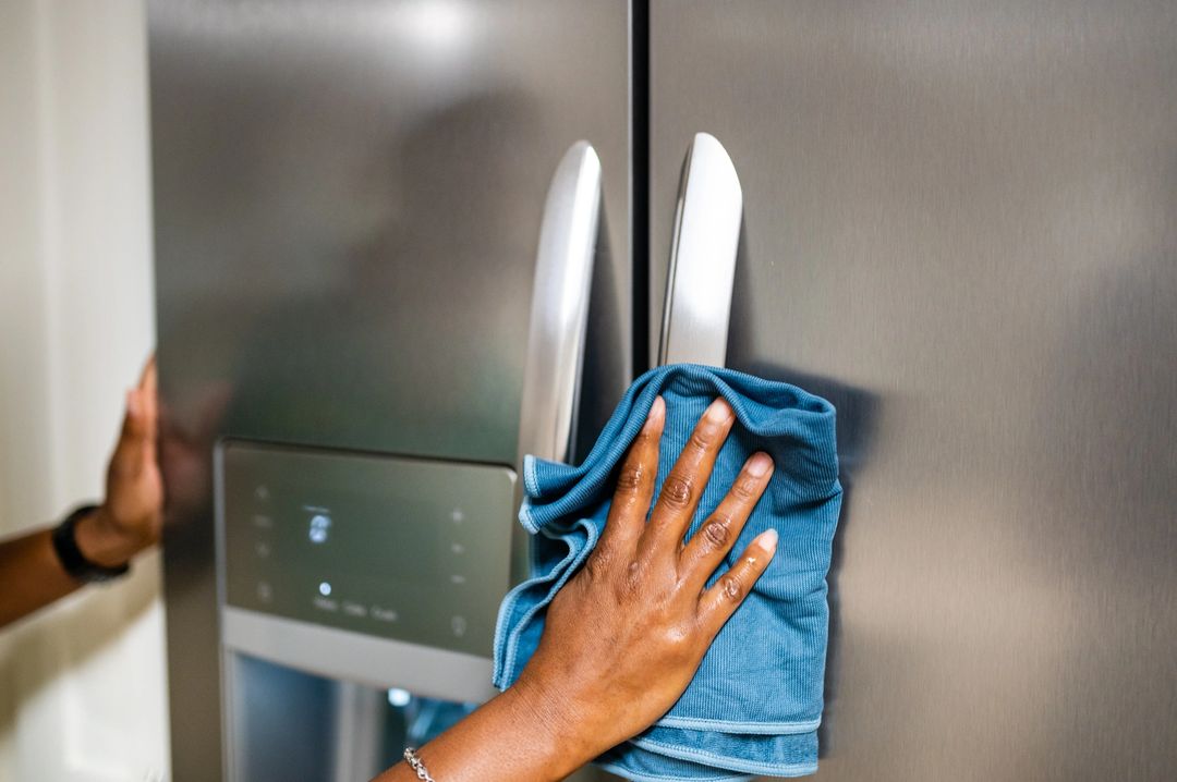 Cleaning Refrigerator With Disinfectant Wipe