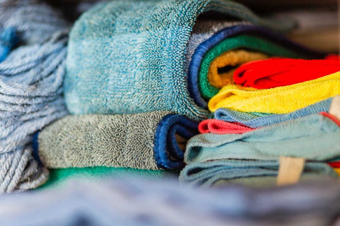 Clean Towels Arranged in Home Laundry Room