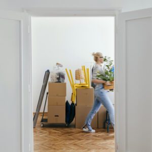 An Anonymous Woman Moving In Into New Apartment