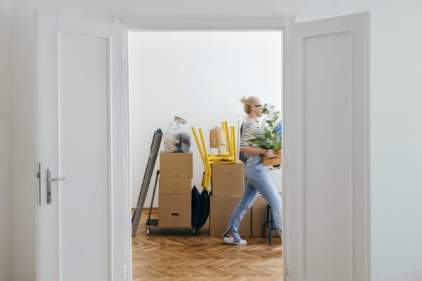 An Anonymous Woman Moving In Into New Apartment